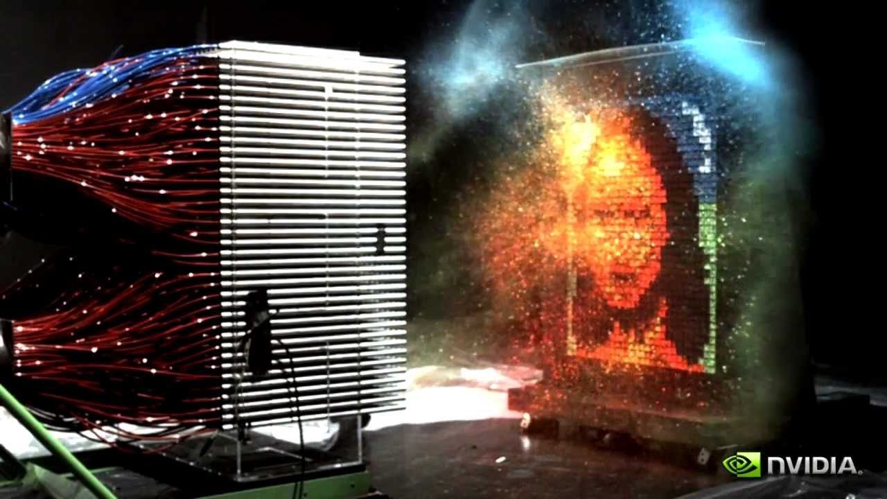 The moment a large paintball machine fires hundreds of paintballs at once toward a hanging canvas, the Mona Lisa bursting into view in a cloud of coloured paint and smoke. An NVIDIA logo is in the corner.